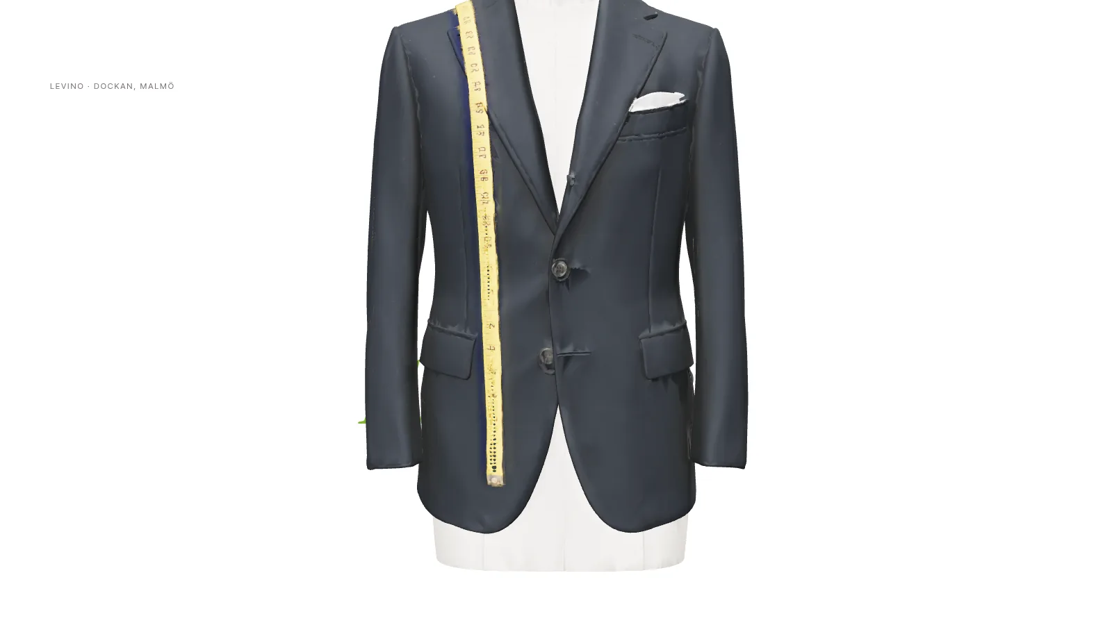 The 3D blazer on its plaster bust rising through the opening headline